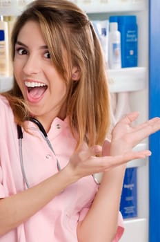 Female pharmacist showing a welcome gesture in a pharmacy