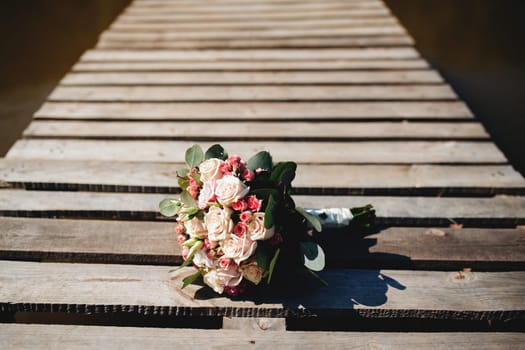 Wedding bouquet on the old wooden terrace. High quality photo