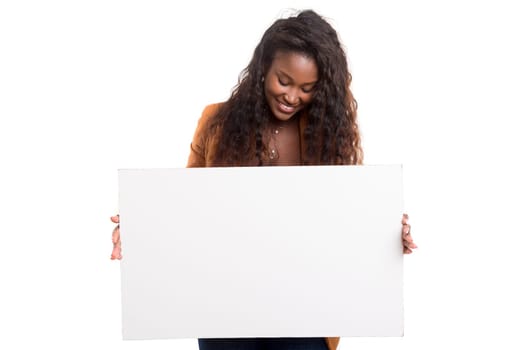 Young beautiful african woman presenting your product, isolated over white background