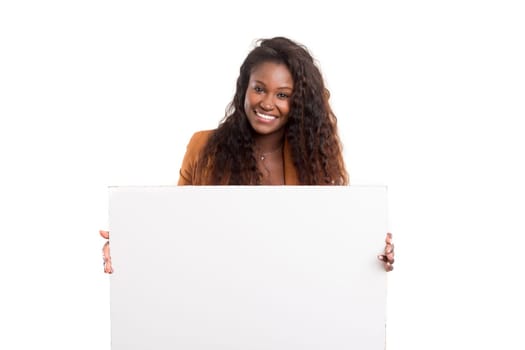 Young beautiful african woman presenting your product, isolated over white background