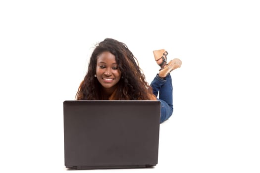 Young african student working with her laptop, isolated over a white background