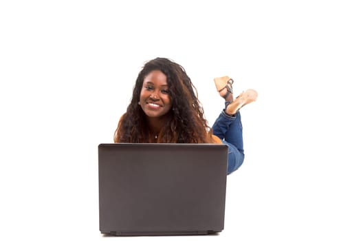 Young african student working with her laptop, isolated over a white background