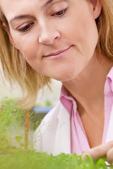 Female scientist researching on plants in a laboratory