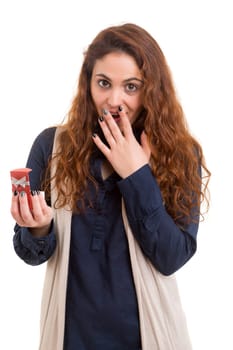 Surprised young woman isolated over white background