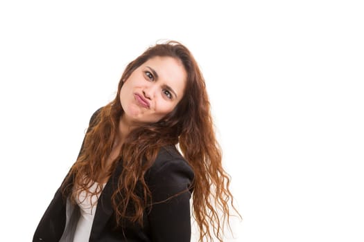 A beautiful young woman making a silly expression, isolated over white