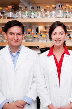 Portrait of two doctors smiling in a laboratory