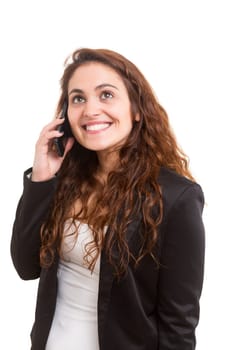 Young beautiful woman at the phone, isolated over a white background