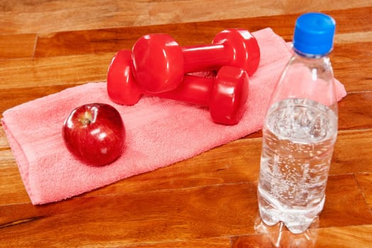 Water bottle with an apple and dumbbells