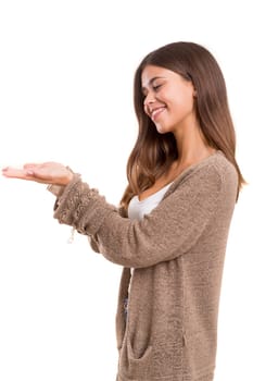 Young beautiful woman presenting your product, isolated over white background