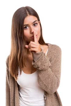 Beautiful young woman asking for silence isolated