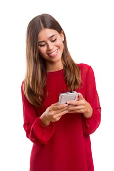 Young beautiful woman at the phone, isolated over a white background