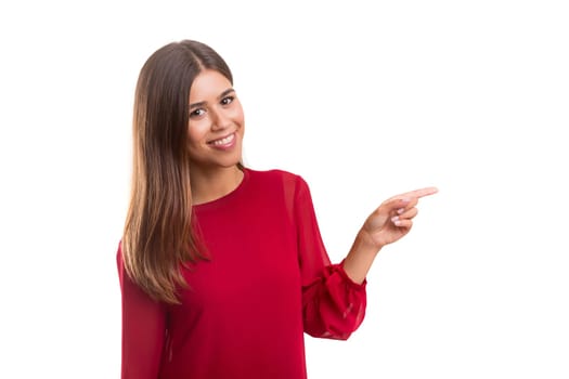 Young beautiful woman presenting your product, isolated over white background