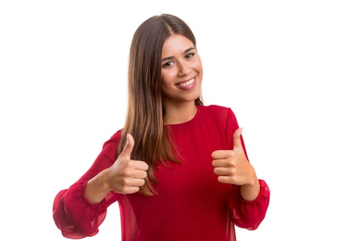 Beautiful young woman signaling ok, isolated over white