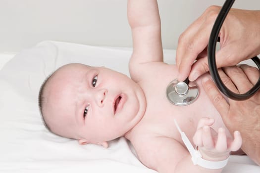 Doctor examining a newborn baby
