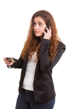 Woman placing an order at the phone with her credit card