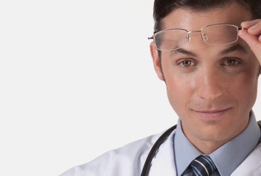Portrait of a doctor holding eyeglasses