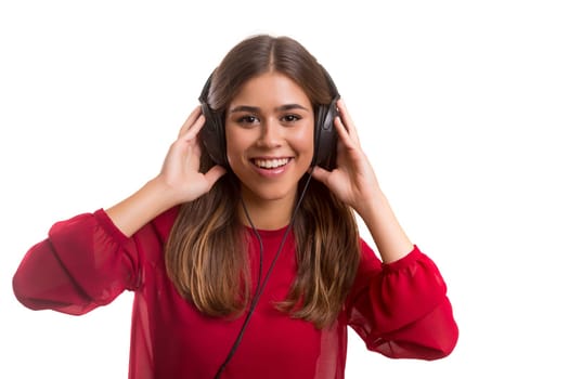 A Happy young woman listening to music