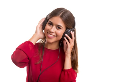 A Happy young woman listening to music
