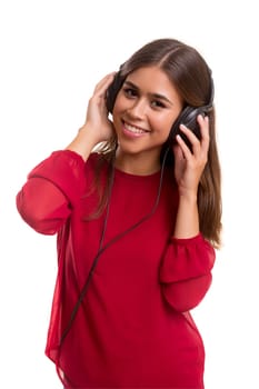 A Happy young woman listening to music