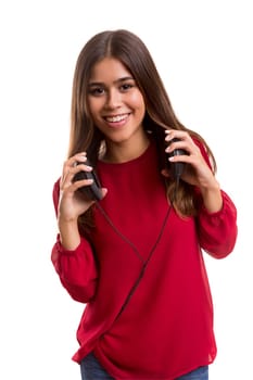 A Happy young woman listening to music