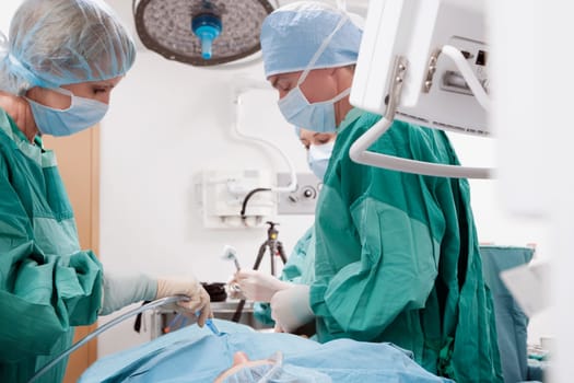 Surgeon performing a surgery in an operating room