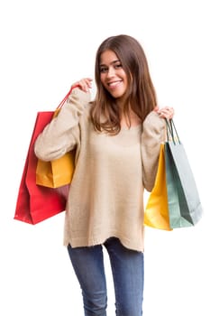 Young beautiful woman with shopping bags, isolated over copy space background