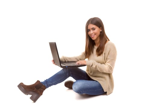 Young student working with her laptop, isolated over a white background