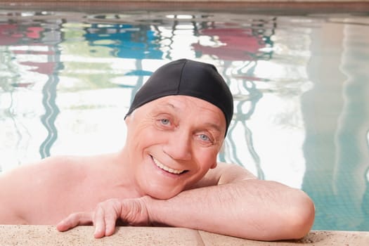 Man smiling in a swimming pool