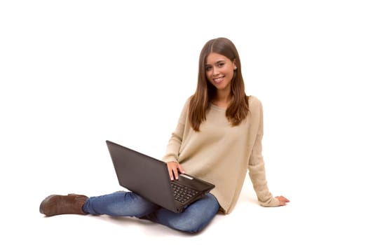 Young student working with her laptop, isolated over a white background