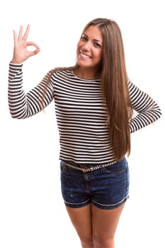 Beautiful young woman signaling ok, isolated over white