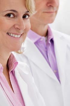 Portrait of a female doctor smiling with a male doctor
