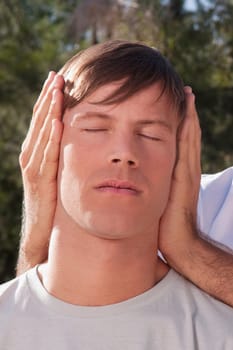 Man receiving a head massage