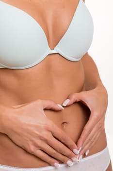 Strong and Fit woman's torso, isolated over a white background