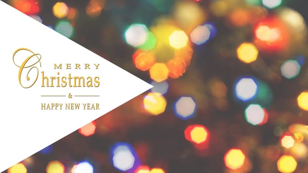 Merry Christmas and Happy New Year greeting card, blurred background of the twinkling lights of the Christmas tree. Greeting card background. Text space