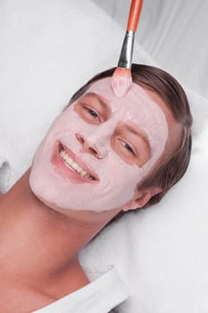 Man applying face pack
