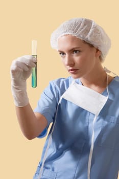 Female lab technician analyzing a test tube
