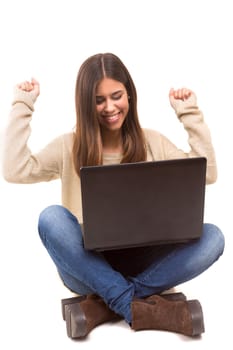 Young student working with her laptop, isolated over a white background
