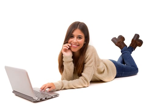 Young student working with her laptop, isolated over a white background
