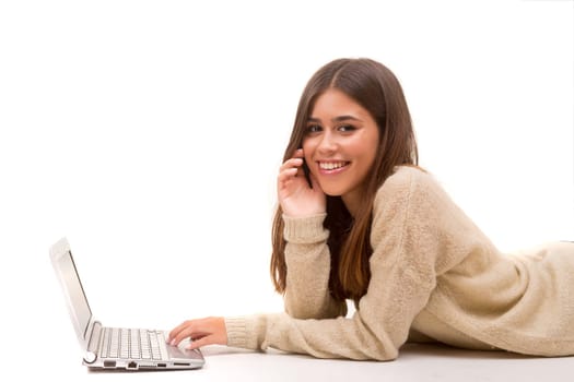 Young student working with her laptop, isolated over a white background