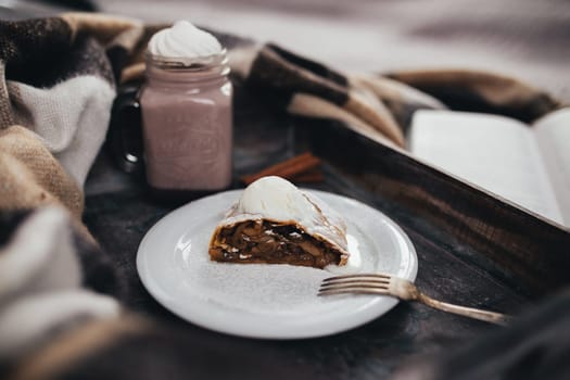 Sweet tasty Christmas strudel on the plate. High quality photo