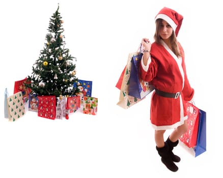 Young Santa Girl close to a Christmas Tree - Isolated over white