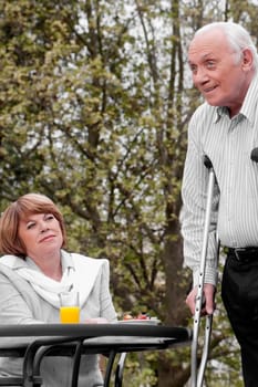 Disabled man using crutches in a rehabilitation center