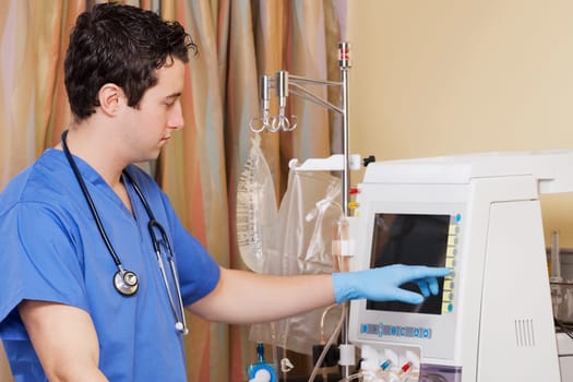 Doctor working on a cardiac monitor screen