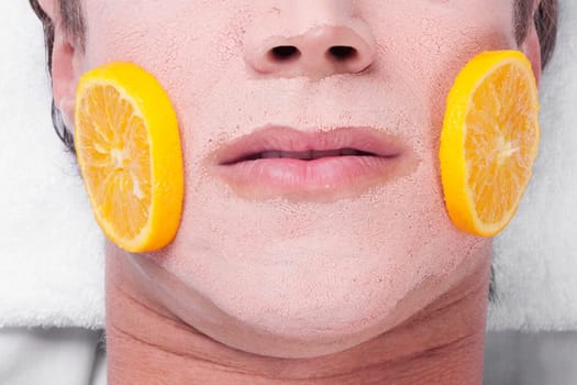 Orange slices on a manŽs face