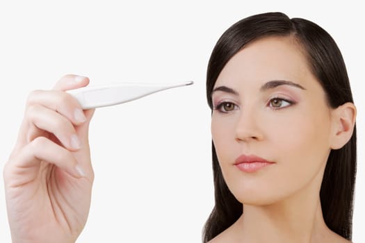 Woman reading a thermometer