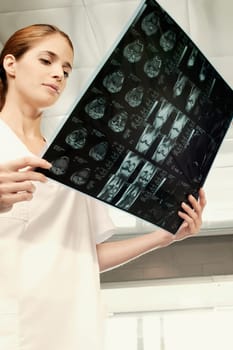 Female nurse examining an X_Ray