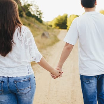 Lovely couple outdoor has romantic photo session. High quality photo