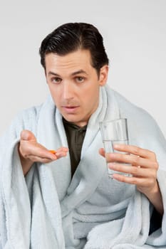 Portrait of a man taking medicine