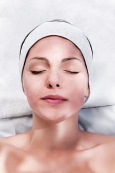 Woman with face pack on her face