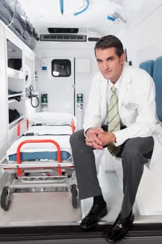 Doctor sitting in an ambulance